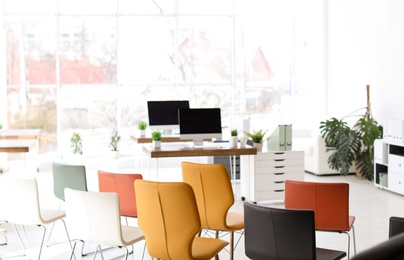 Office interior with many comfortable chairs. Business training
