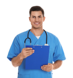 Doctor with clipboard and stethoscope on white background