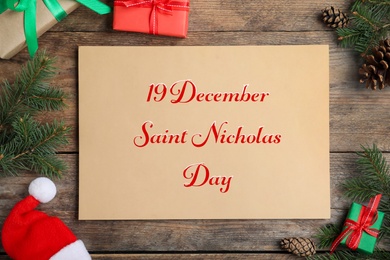 19 December Saint Nicholas Day. Flat lay composition with card on wooden table.