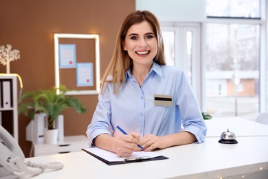 Female receptionist at hotel check-in counter