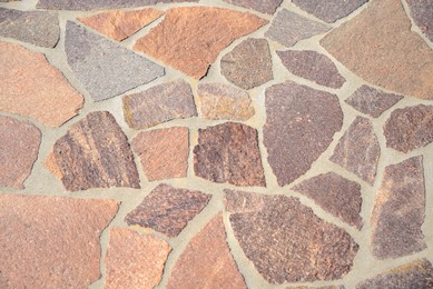 Beautiful pavement with stone fragments as background, top view