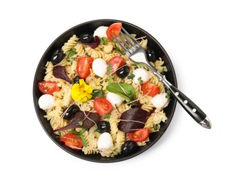 Bowl of delicious pasta with tomatoes, olives and mozzarella on white background, top view