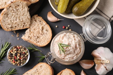 Photo of Delicious lard spread on black table, flat lay
