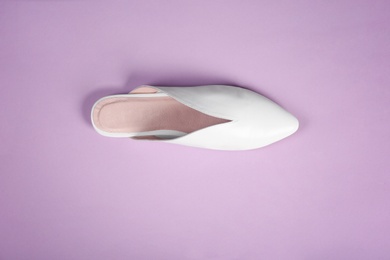 Photo of Female shoe on color background, top view
