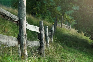 Beautiful countryside landscape with wooden fence on hill