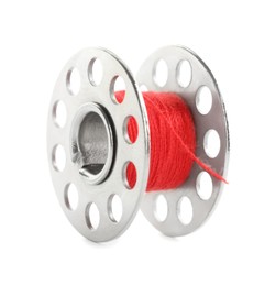 Metal spool of red sewing thread isolated on white