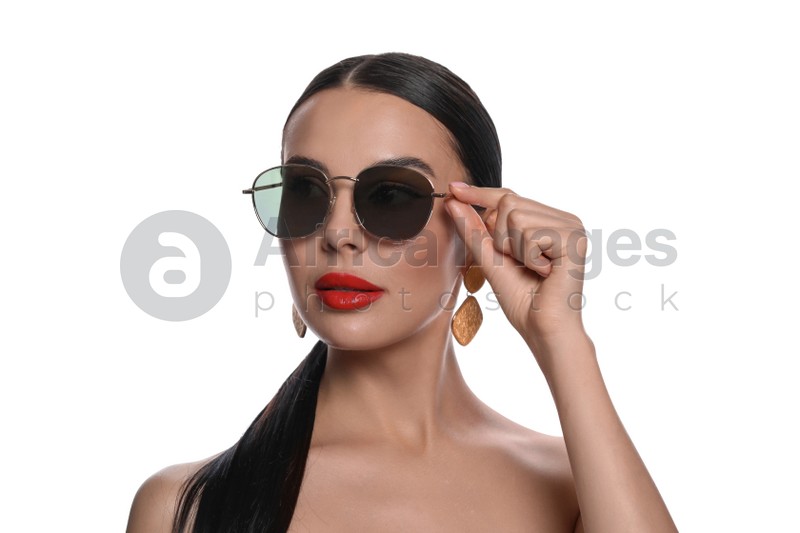 Attractive woman wearing fashionable sunglasses against white background