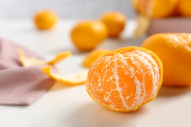 Fresh tangerines on white table. Citrus fruit