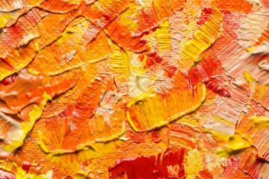 Beautiful strokes of colorful oil paints as background, closeup