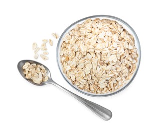 Raw oatmeal, glass bowl and spoon on white background, top view