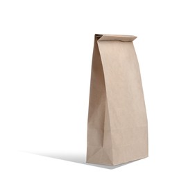 New closed paper bag on white background