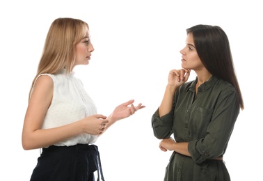 Young women in casual clothes talking on white background