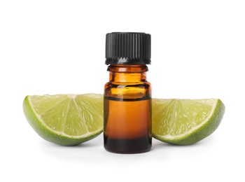 Bottle of citrus essential oil and cut fresh lime isolated on white