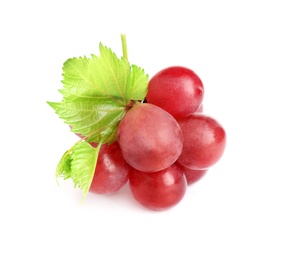 Bunch of red grapes with green leaves isolated on white