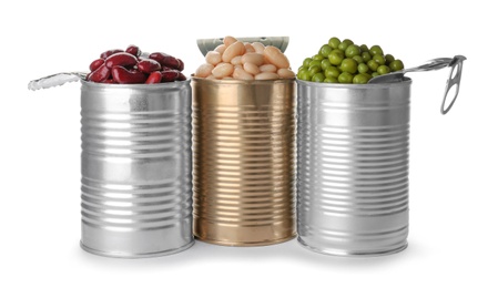 Tin cans with conserved vegetables on white background