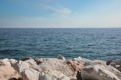 Beautiful view of rocky beach and calm sea on sunny day