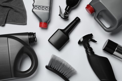 Flat lay composition with different car wash products on white background