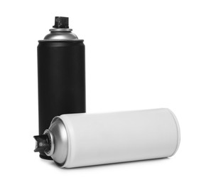 Cans of different spray paints on white background. Graffiti supplies