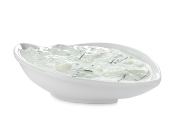 Gravy boat with cucumber sauce on white background