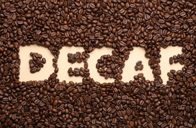 Photo of Word Decaf in coffee beans, top view