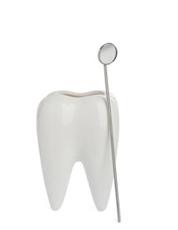 Tooth shaped holder and mouth mirror on white background