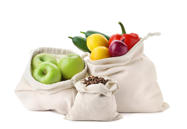 Cotton eco bags with fruits, vegetables and coffee beans isolated on white