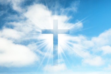 Silhouette of cross against blue sky. Christian religion