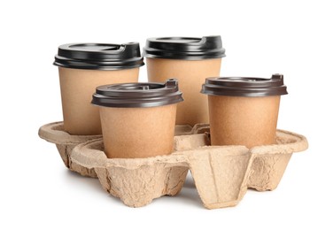 Takeaway paper coffee cups in cardboard holder on white background