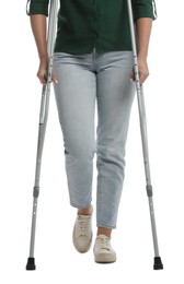 Woman with crutches on white background, closeup