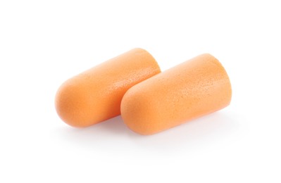 Pair of orange ear plugs isolated on white