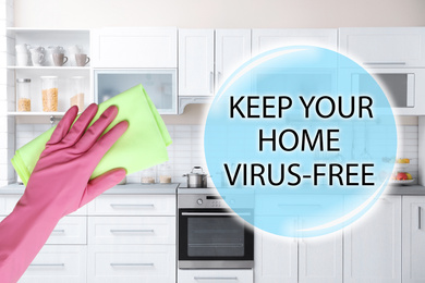 Image of Keep your home virus-free. Woman with rag and clean kitchen on background