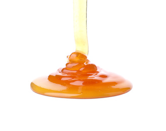 Pouring sweet fresh honey isolated on white