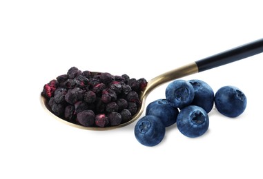 Sweet sublimated and fresh blueberries on white background