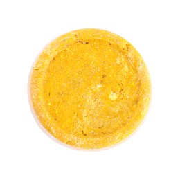 Yellow solid shampoo isolated on white, top view. Hair care