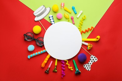 Flat lay composition with carnival items and blank card on color background. Space for text