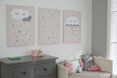 Baby room interior with cute posters and comfortable bed