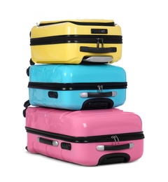 Stylish suitcases packed for travel on white background. Summer vacation