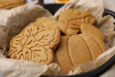 Photo of Different tasty cookies in baking dish, closeup