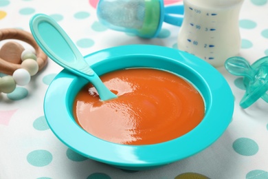 Healthy baby food in bowl on table, closeup