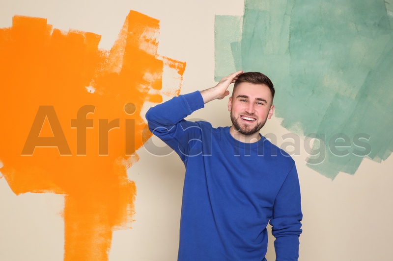 Portrait of handsome man on color background