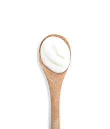 Wooden spoon with sour cream on white background, top view