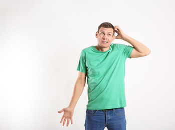 Emotional man in casual outfit on white background