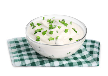 Fresh sour cream with onion and fabric on white background
