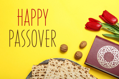 Flat lay composition with matzos on yellow background. Passover (Pesach) celebration