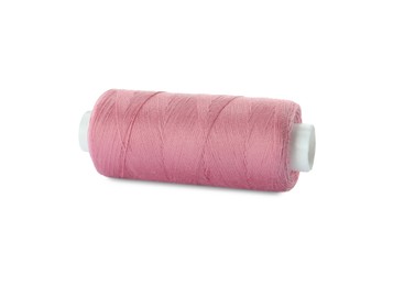 Spool of pink sewing thread isolated on white