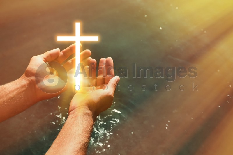 Man and cross silhouette outdoors, closeup view with space for text. Belief in Jesus Christ 