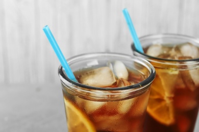 Photo of Glasses of delicious refreshing iced tea, closeup
