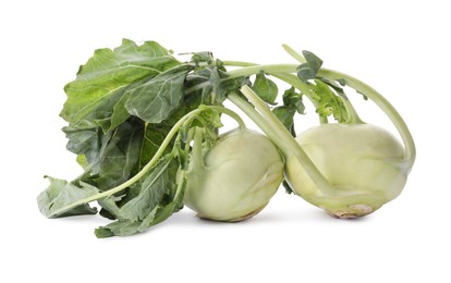 Whole ripe kohlrabies with leaves on white background