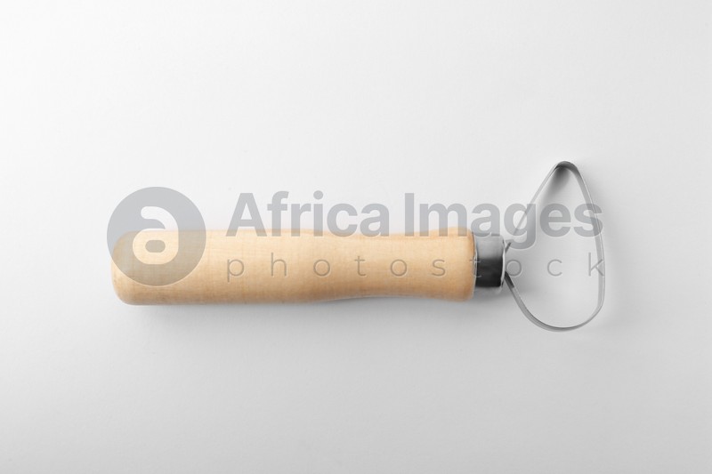 Photo of Loop tool with wooden handle for clay modeling on white background, top view