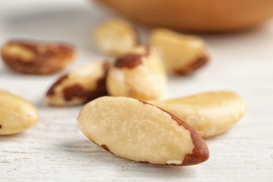 Tasty Brazil nuts on white table, closeup